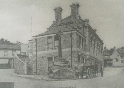 A historic black and white image of the Bovey Tracy town hall in its early life